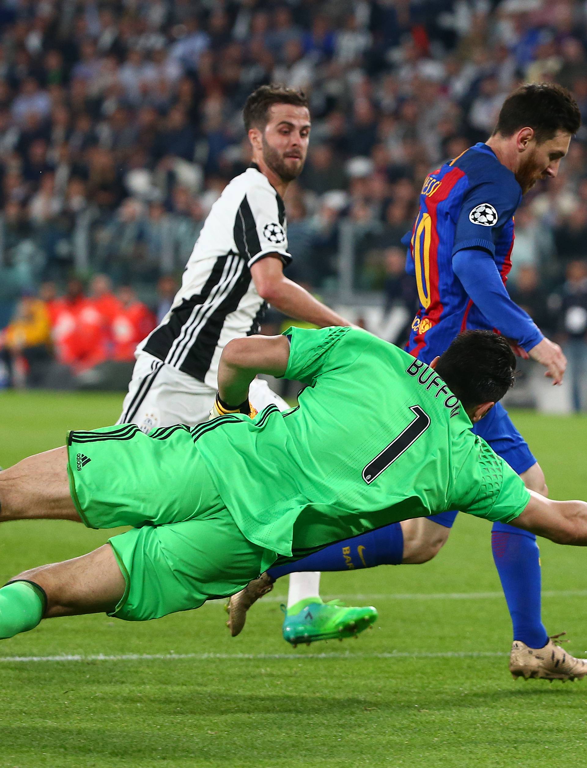 Barcelona's Lionel Messi scores a goal that is disallowed as Juventus' Gianluigi Buffon attempts to make a save