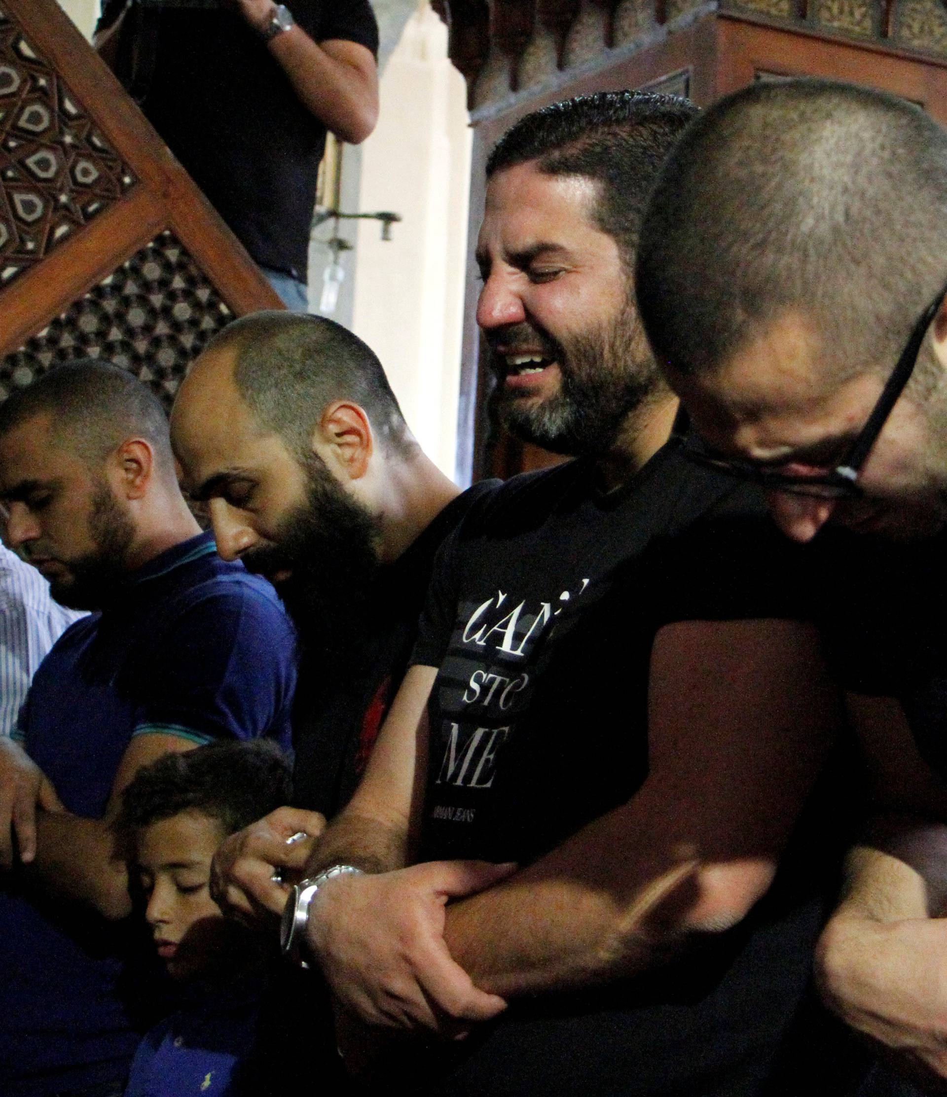 Relatives of the victims of the missing EgyptAir flight MS804 hold an absentee funeral prayer in a mosque nearby Cairo airport, in Cairo 