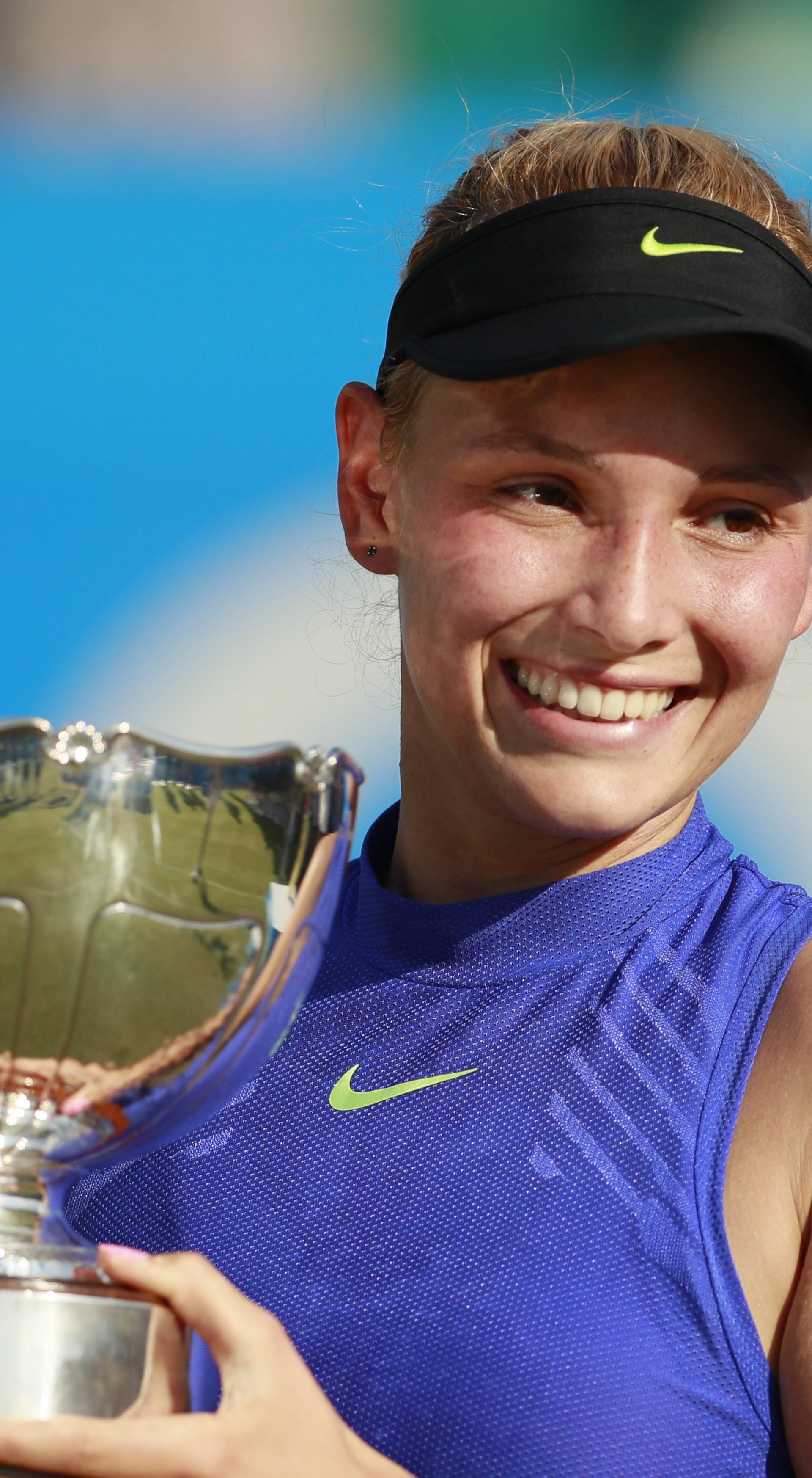 Croatia's Donna Vekic celebrates winning the final with the trophy