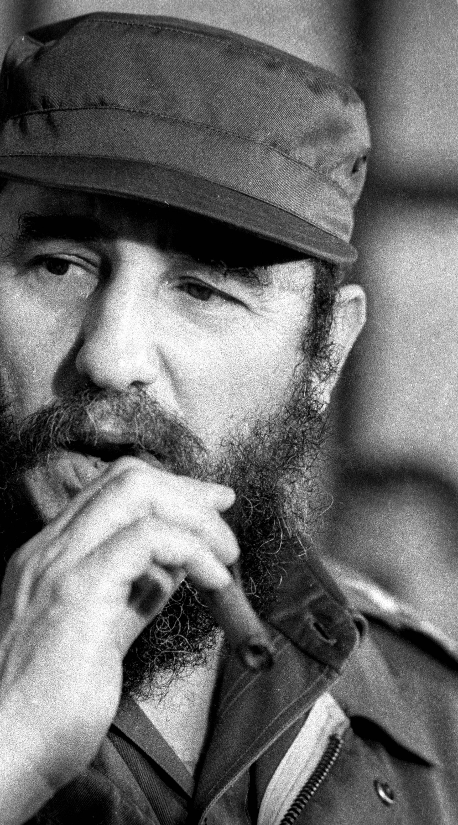 File photo of then Cuban President Fidel Castro smoking a cigar during a meeting of the National Assembly in Havana