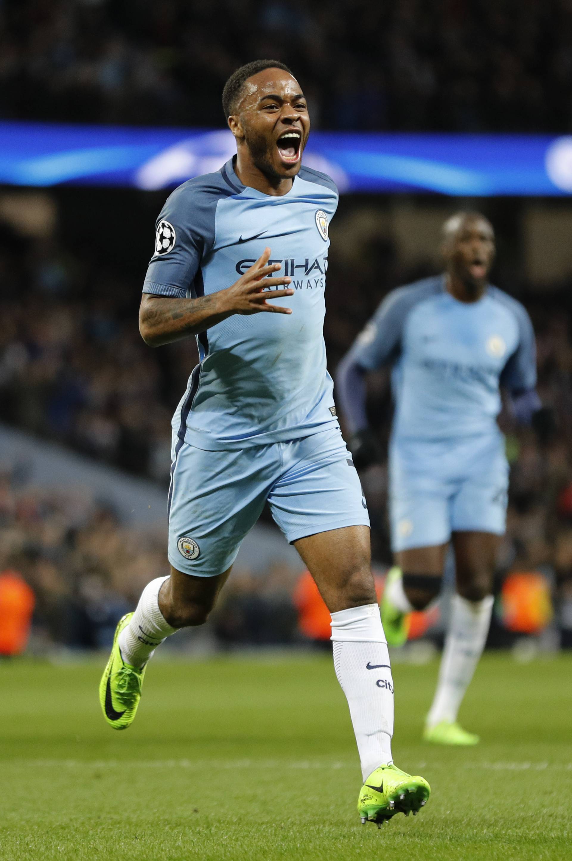 Manchester City's Raheem Sterling celebrates scoring their first goal