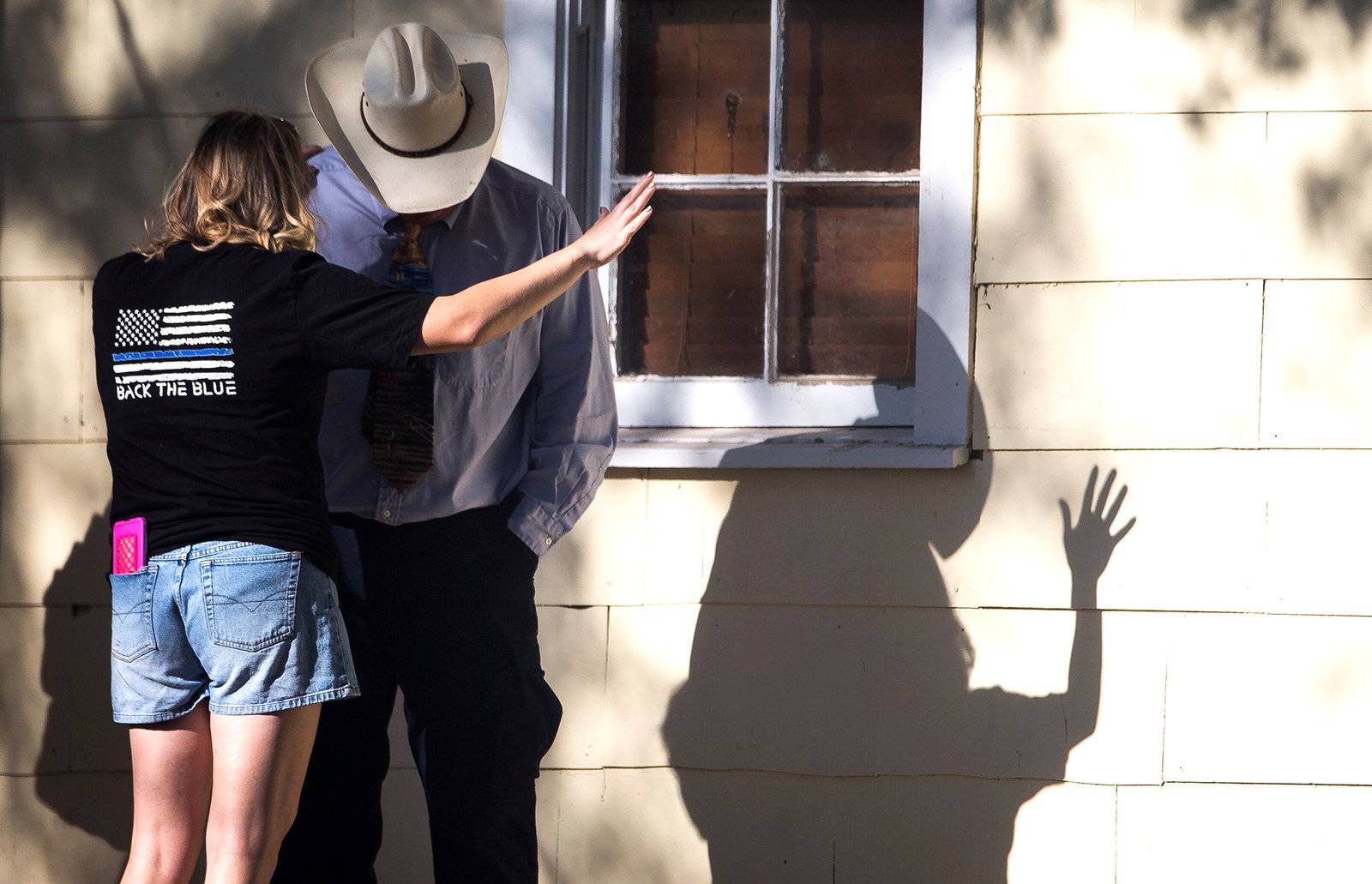 A woman prays after a mass shooting at the First Baptist Church in Sutherland Springs