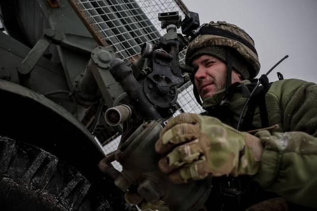 Ukrainian servicemen fire a Grad MLRS towards Russian troops near the frontline town of Chasiv Yar