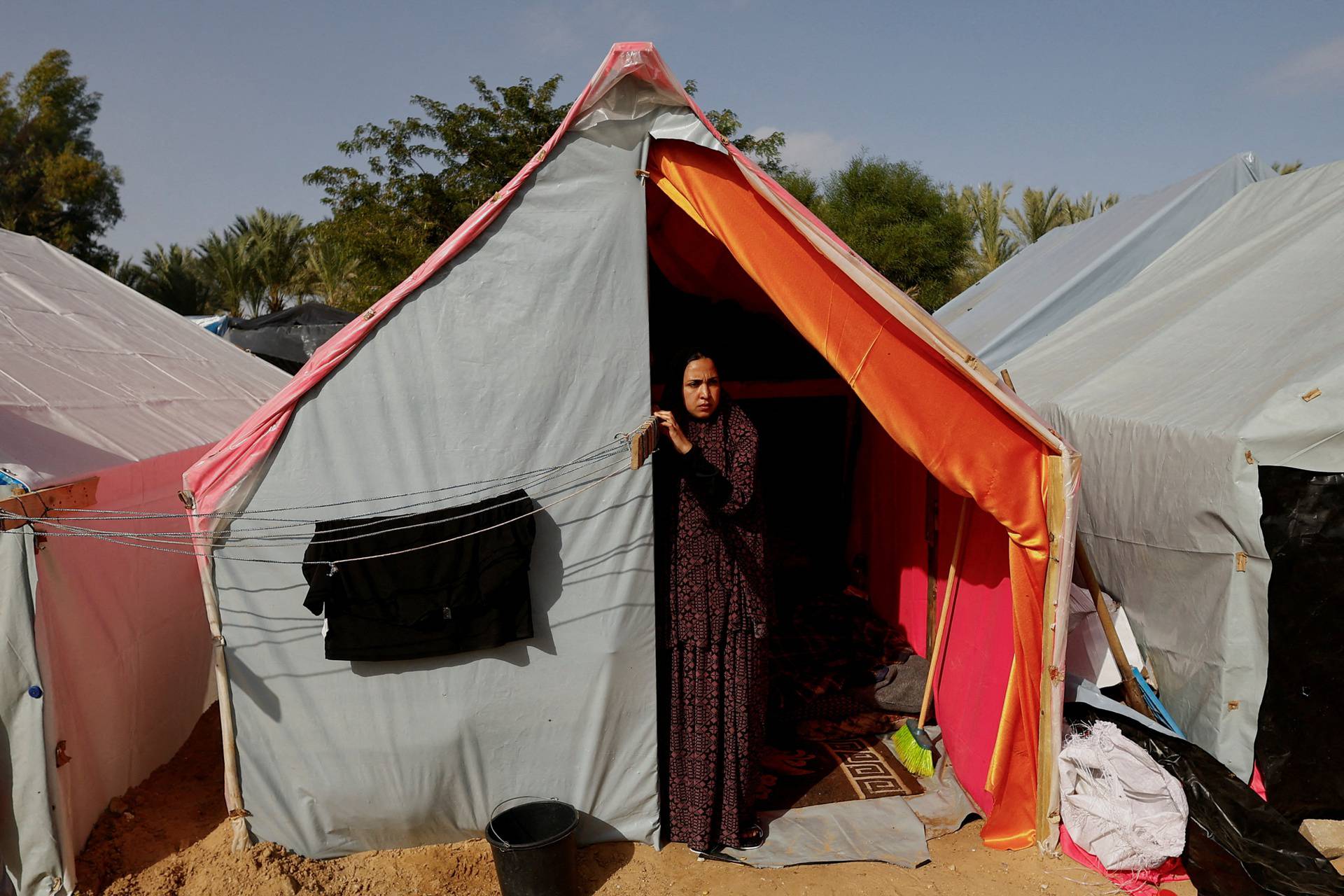 Displaced Palestinians, who fled their houses due to Israeli strikes, shelter in tents at Nasser Hospital in Khan Younis