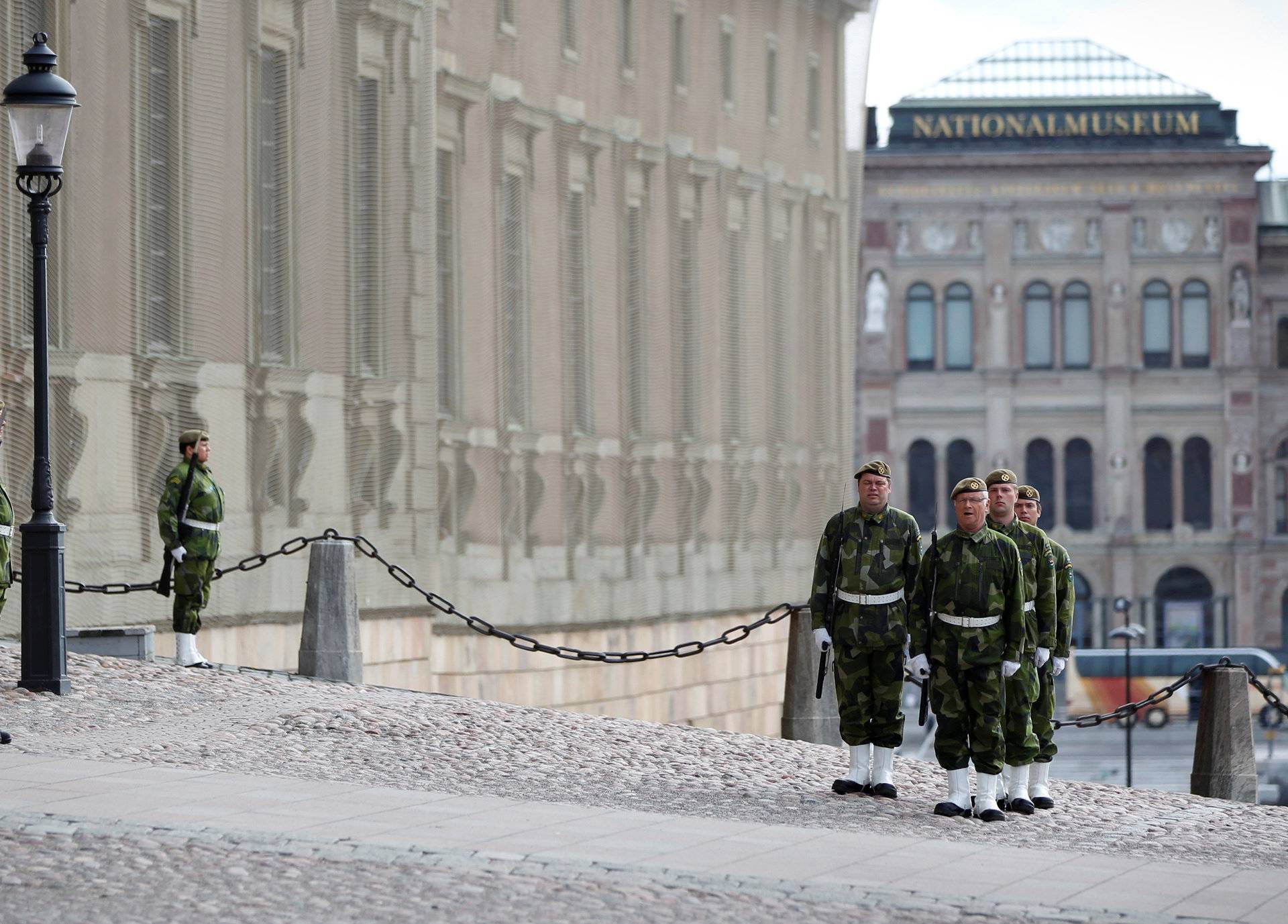 FILE PHOTO: Members of the Royal Palace guard take part in a shift change outside the palace in the Old Town district of Stockholm