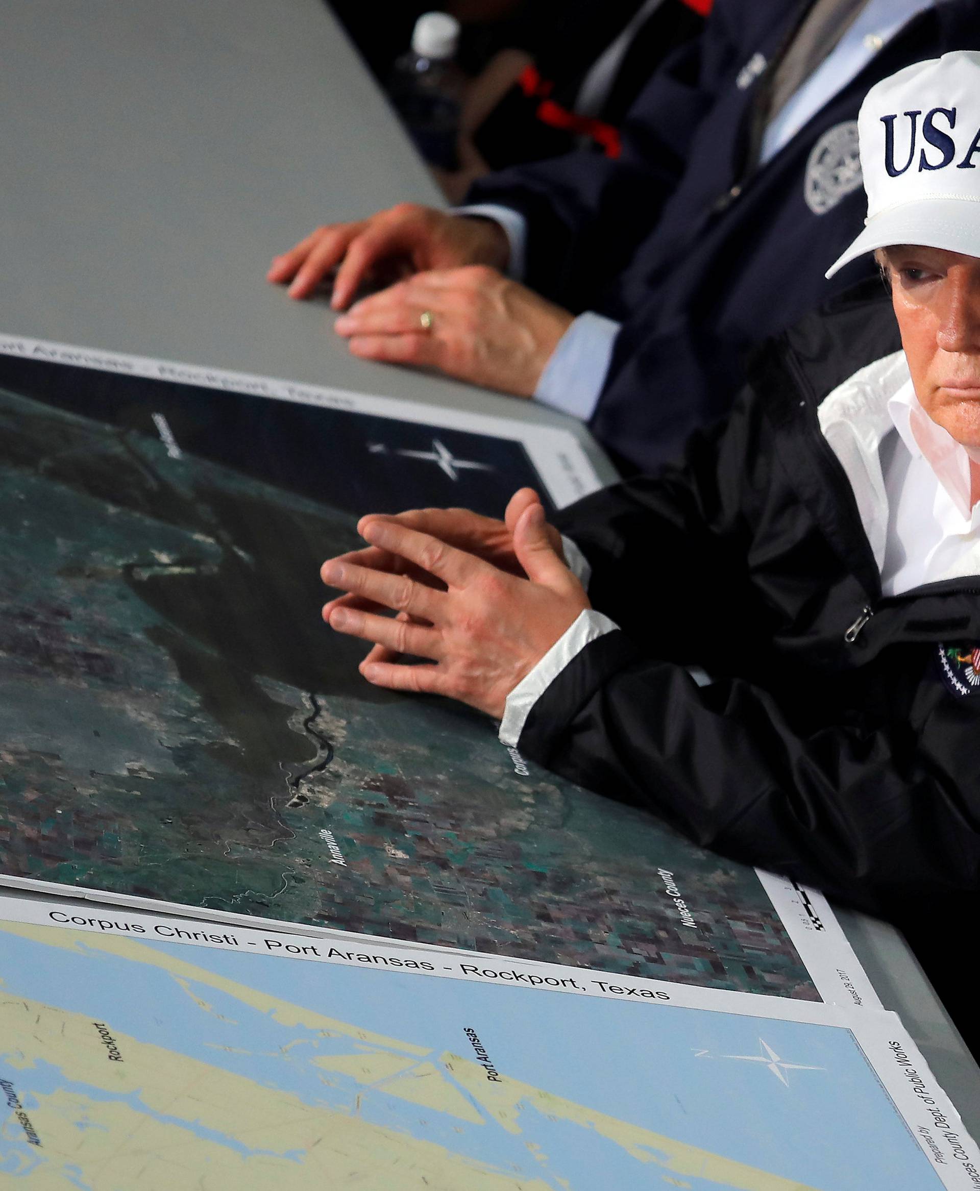 U.S. President Trump receives a briefing on Tropical Storm Harvey relief efforts in Corpus Christi