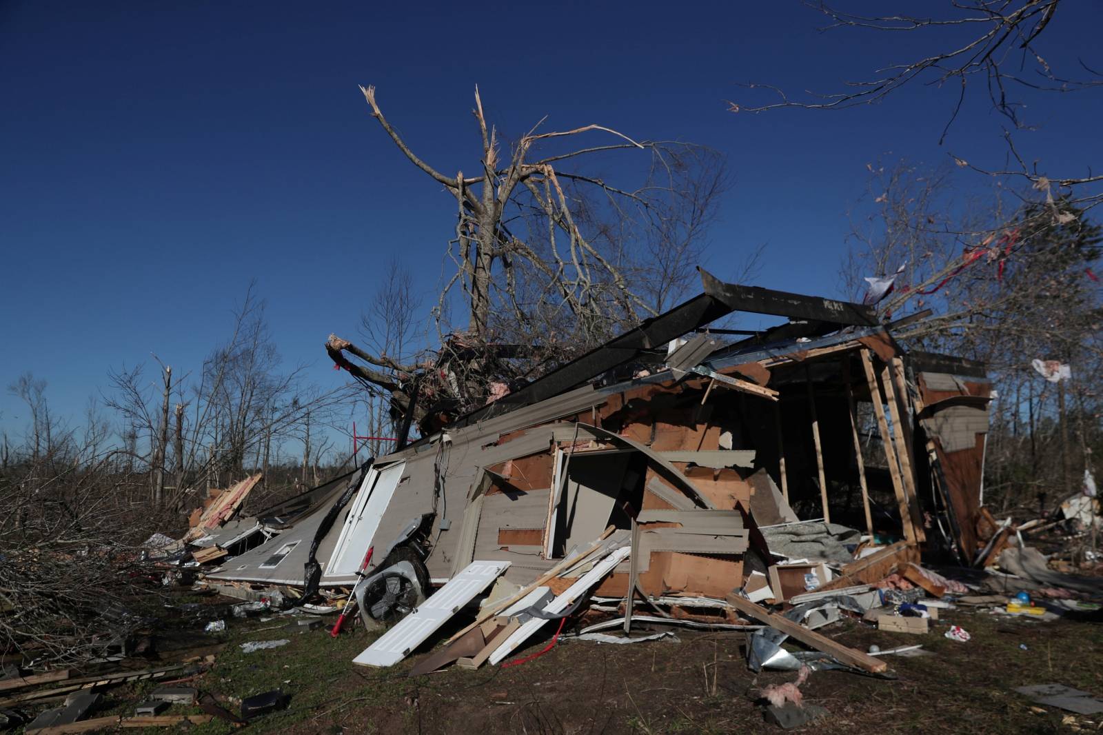 A house is seen devastated after two deadly back-to-back tornadoes, in Beauregard, Alabama