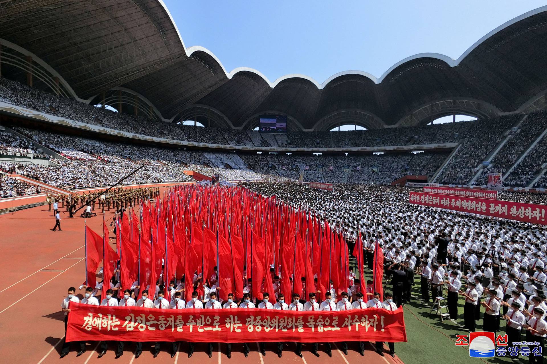 People attend a mass rally denouncing the U.S. in Pyongyang