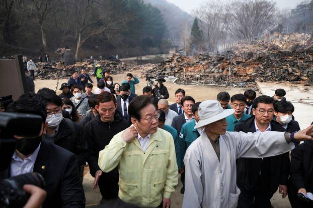 Lee Jae-myung, leader of South Korea's main opposition Democratic Party, visits the devastated Gounsa temple in Uiseong