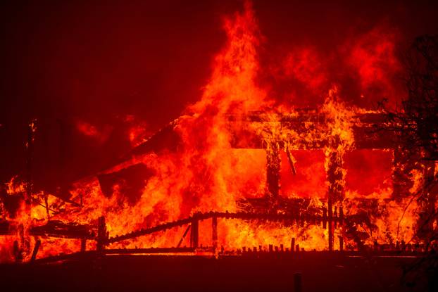 Palisades Fire burns during a windstorm on the west side of Los Angeles