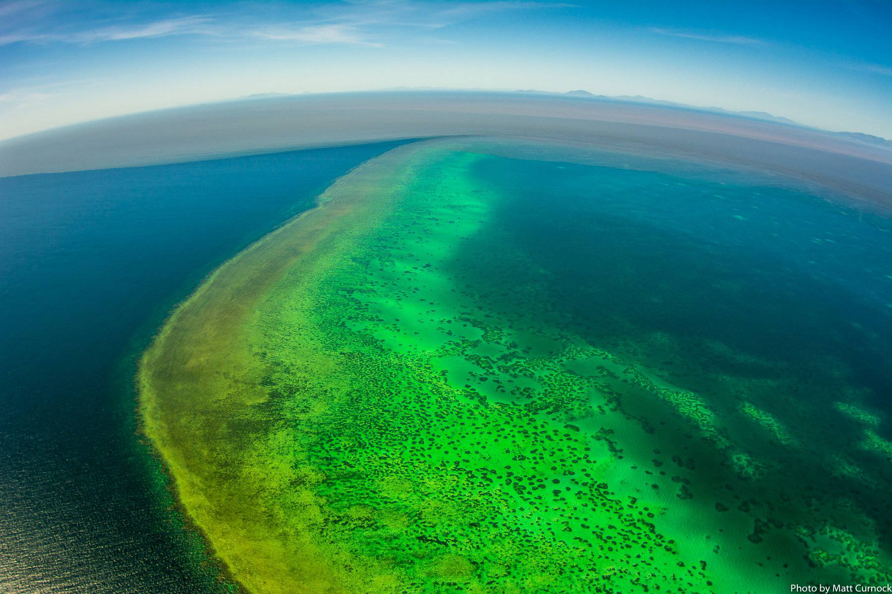 Sediment-filled water is seen in the Great Barrier Reef