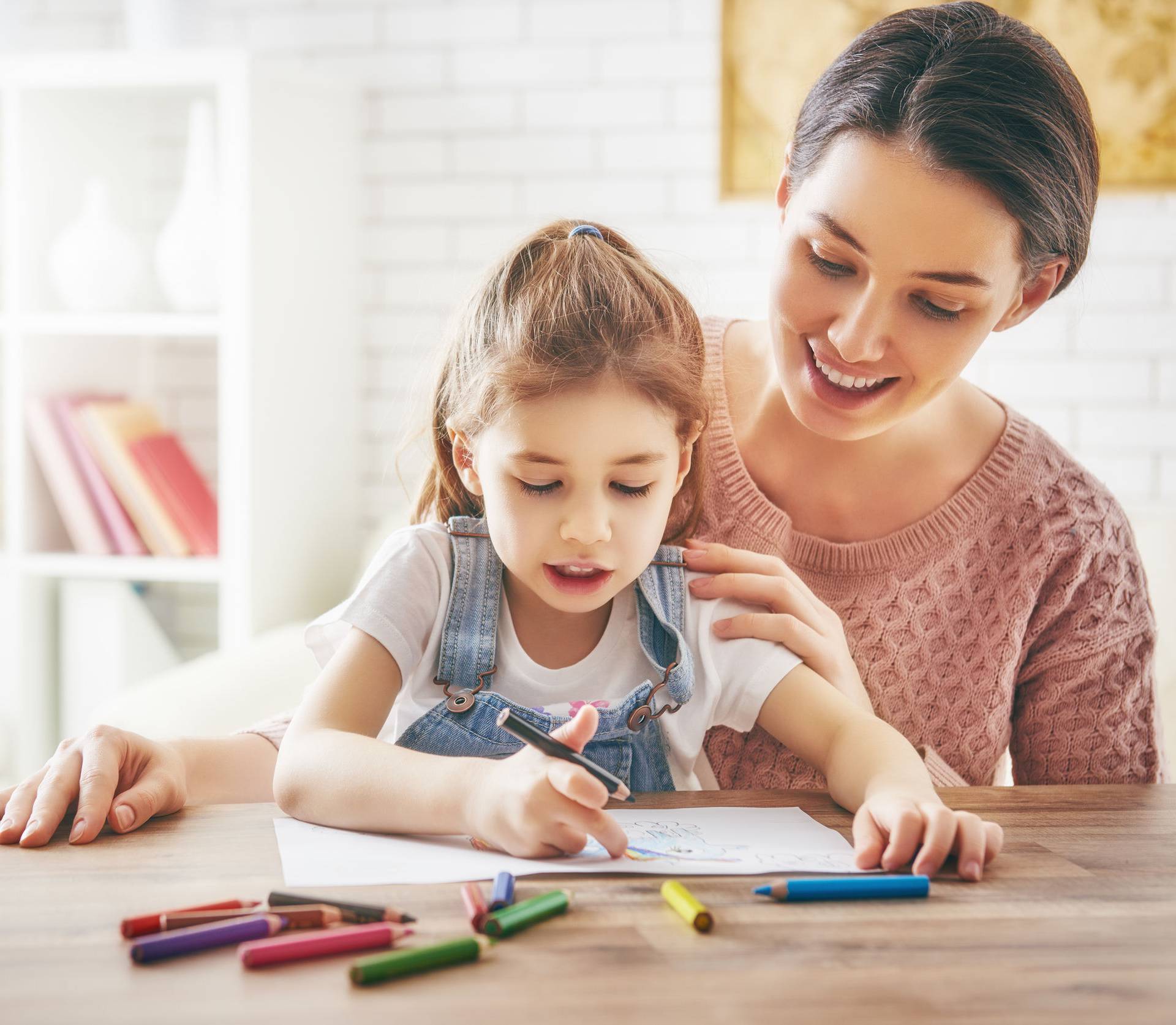 Mother and daughter together paint