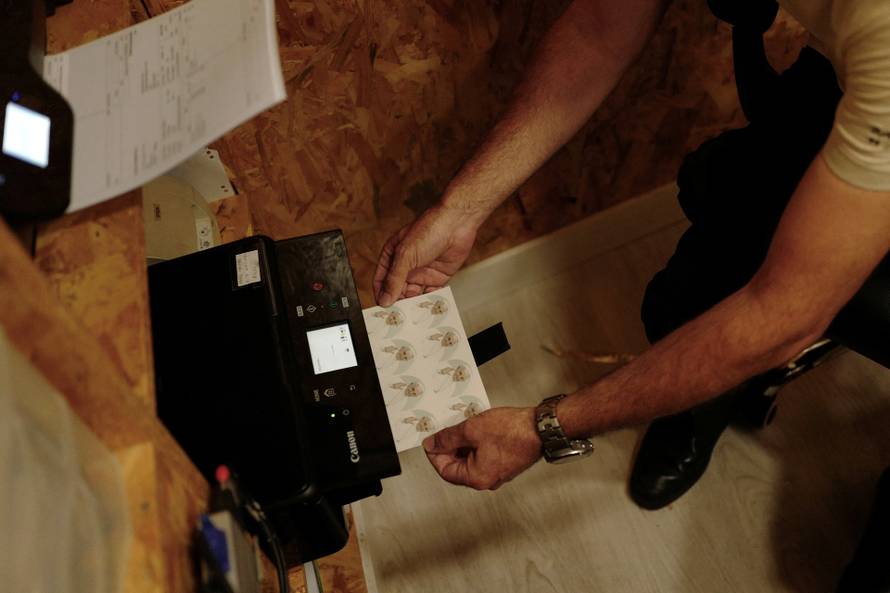 Images of Pope Francis are printed to be applied to cookies ahead of his apostolic journey to Portugal, in Lisbon