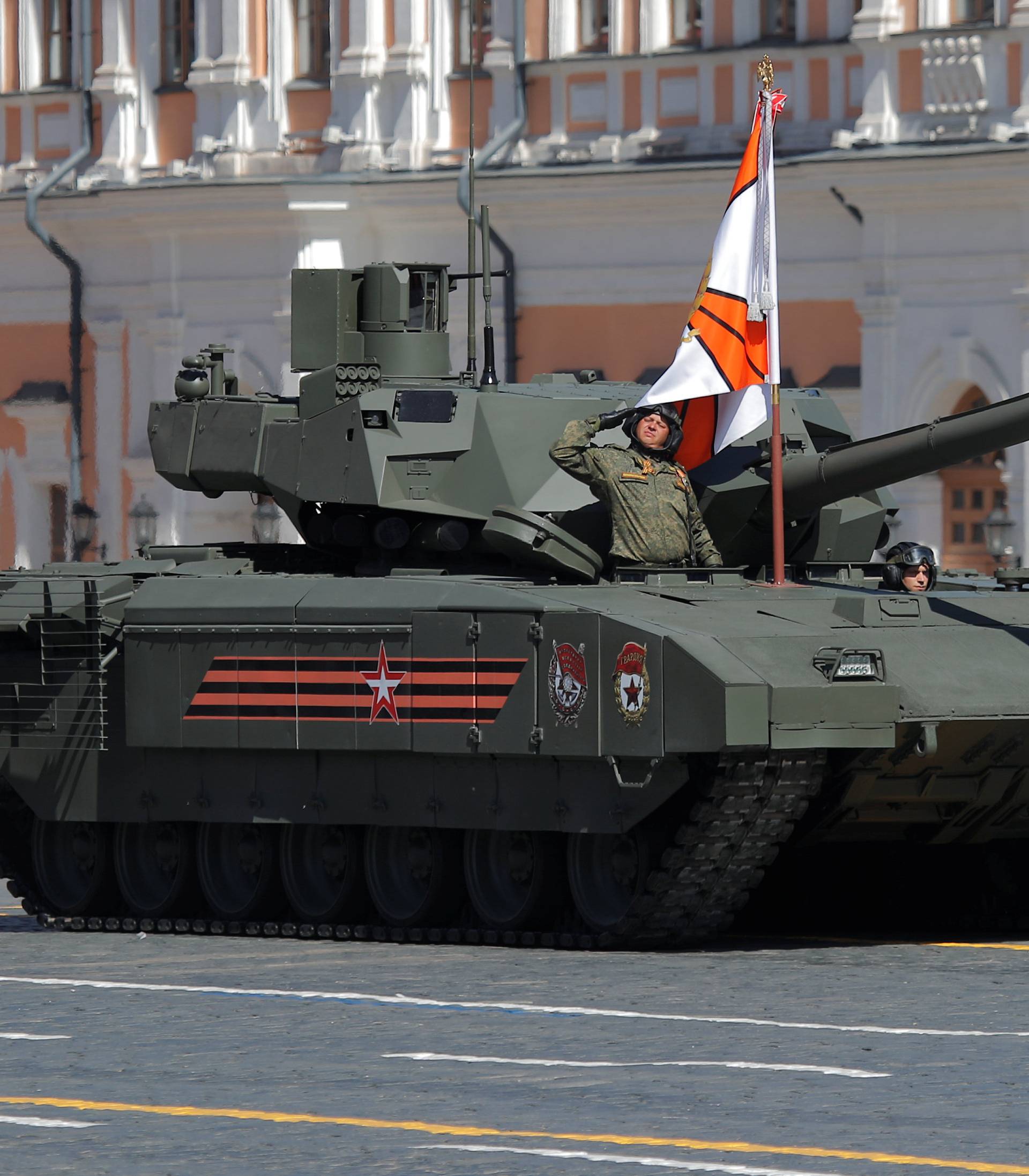 Russian servicemen drive a T-14 Armata tank during the Victory Day paradeat Red Square in Moscow