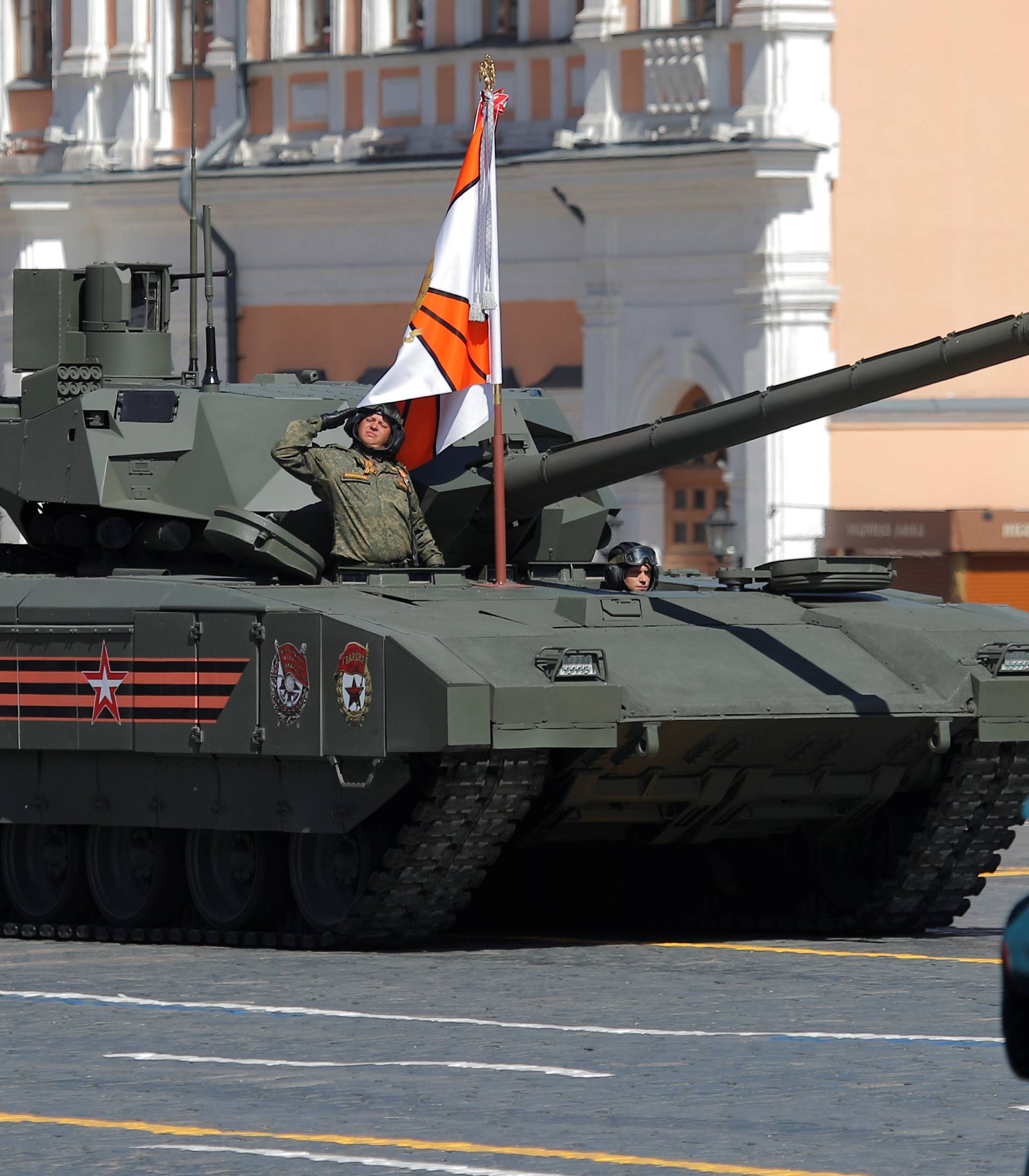 Russian servicemen drive a T-14 Armata tank during the Victory Day paradeat Red Square in Moscow