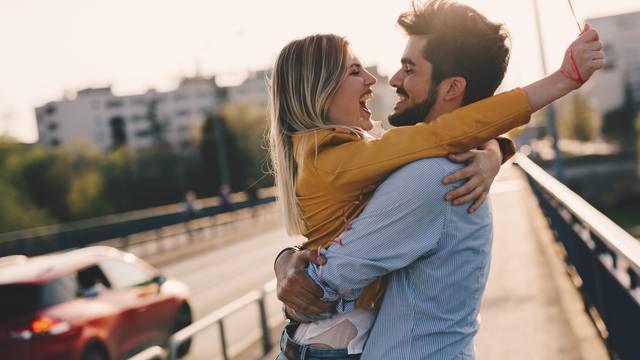 young couple hugging dating and kissing outdoor