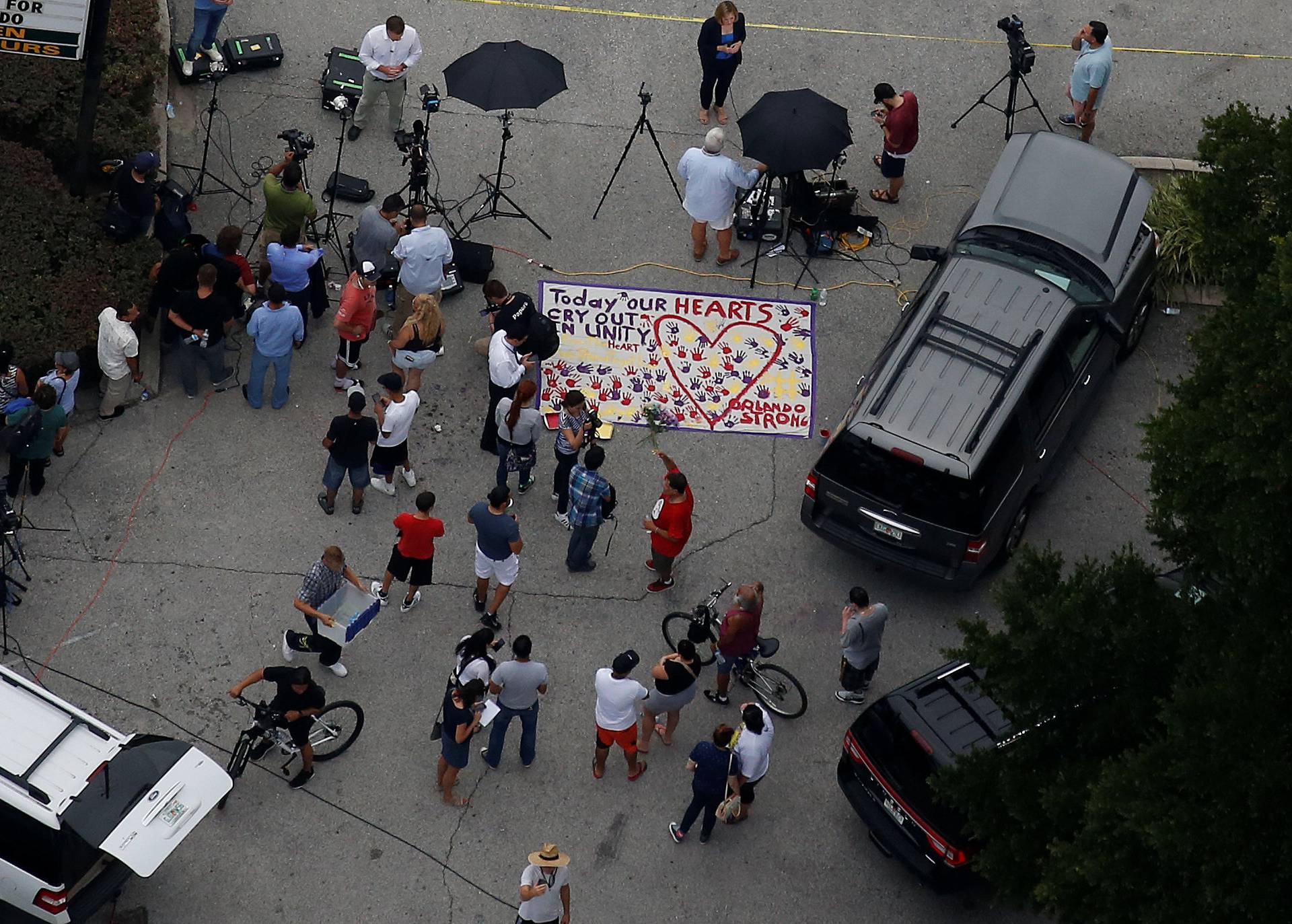 A sign as part of a makeshift memorial is pictured following a mass shooting at the Pulse gay nightclub in Orlando 