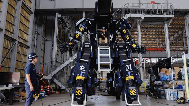 CEO Ryo Yoshida and CTO Akinori Ishii ARCHAX, a giant human-piloted robot, in Yokohama, Japan