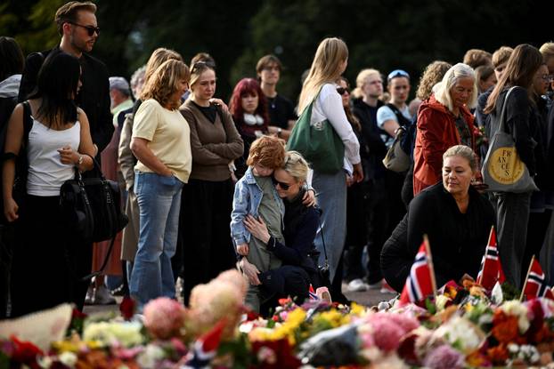 People gather outside the Royal Palace, following the death of Norway's King Harald, in Oslo