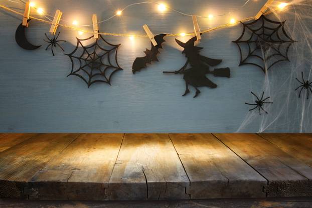Halloween holiday background with empty rustic table. Ready for product display montage
