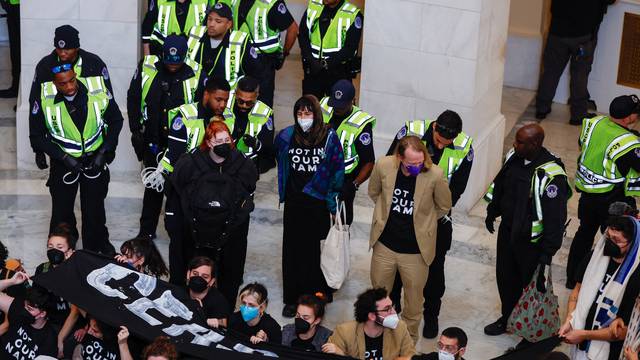 Protesters calling for a cease fire in Gaza occupy House office building rotunda on Capitol Hill in Washington