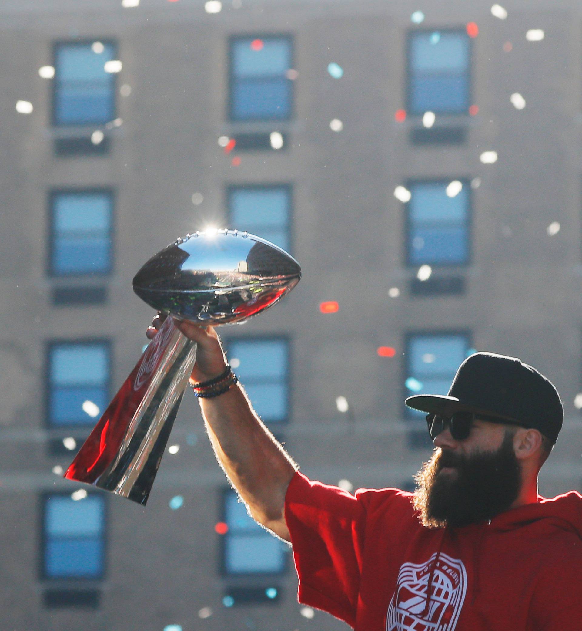 Super Bowl MVP New England Patriots wide receiver Julian Edelman carries a Lombardi trophy during a victory parade in Boston