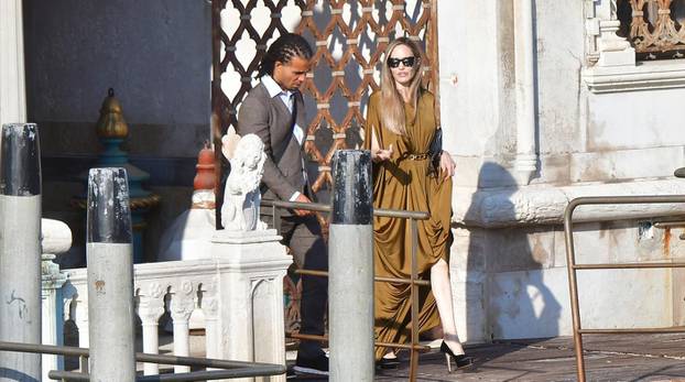 *EXCLUSIVE* American Actress Angelina Jolie looks glamorous rocking a Grecian dress while seen with rapper Akala as they are seen leaving the hotel to attend the the Maria premiere during the Venice Film Festival.