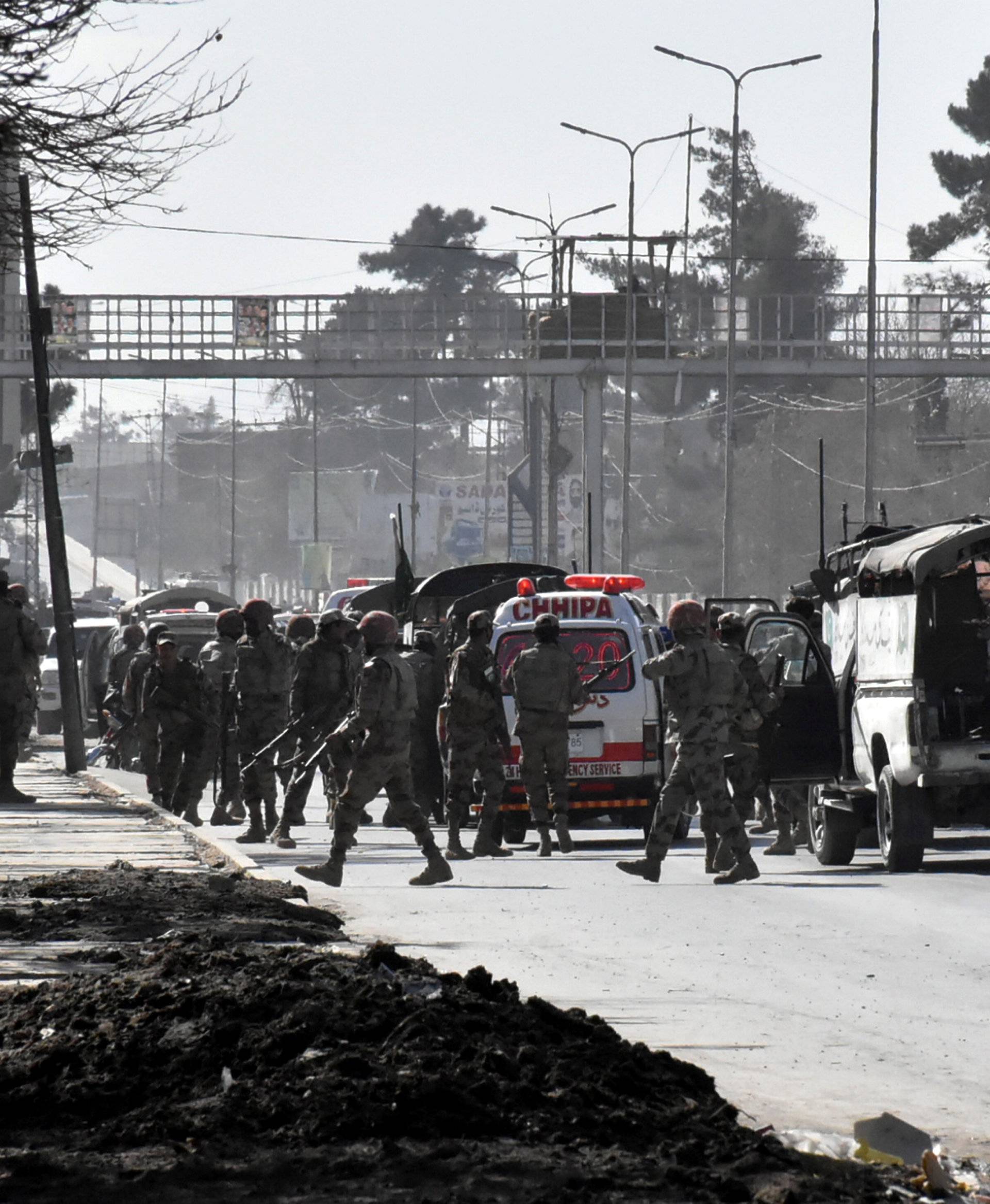 Army vehicles and ambulances gather outside the Bethel Memorial Methodist Church after an attack by gunmen, in Quetta