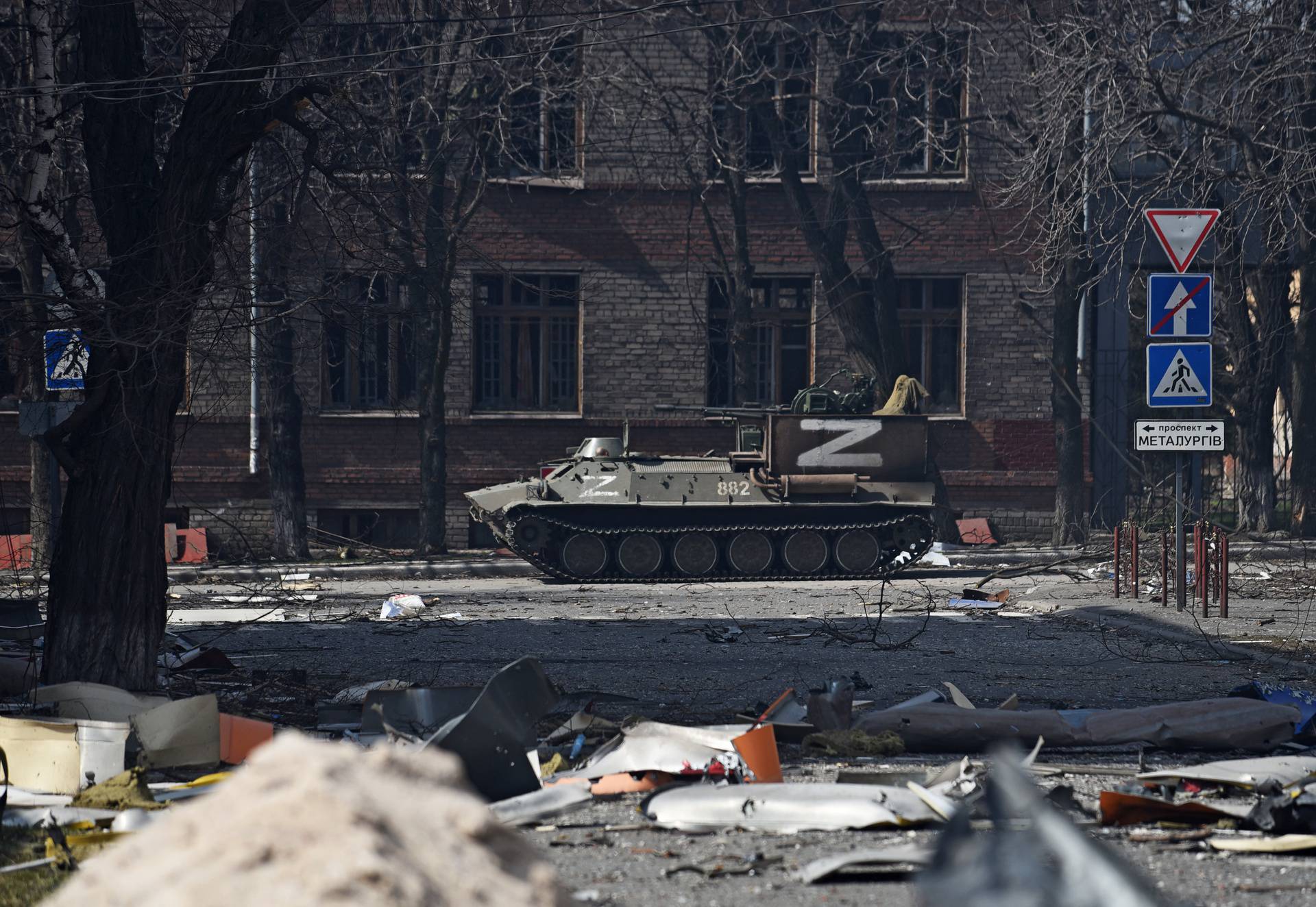 An armoured vehicle of pro-Russian troops drives along a street in Mariupol