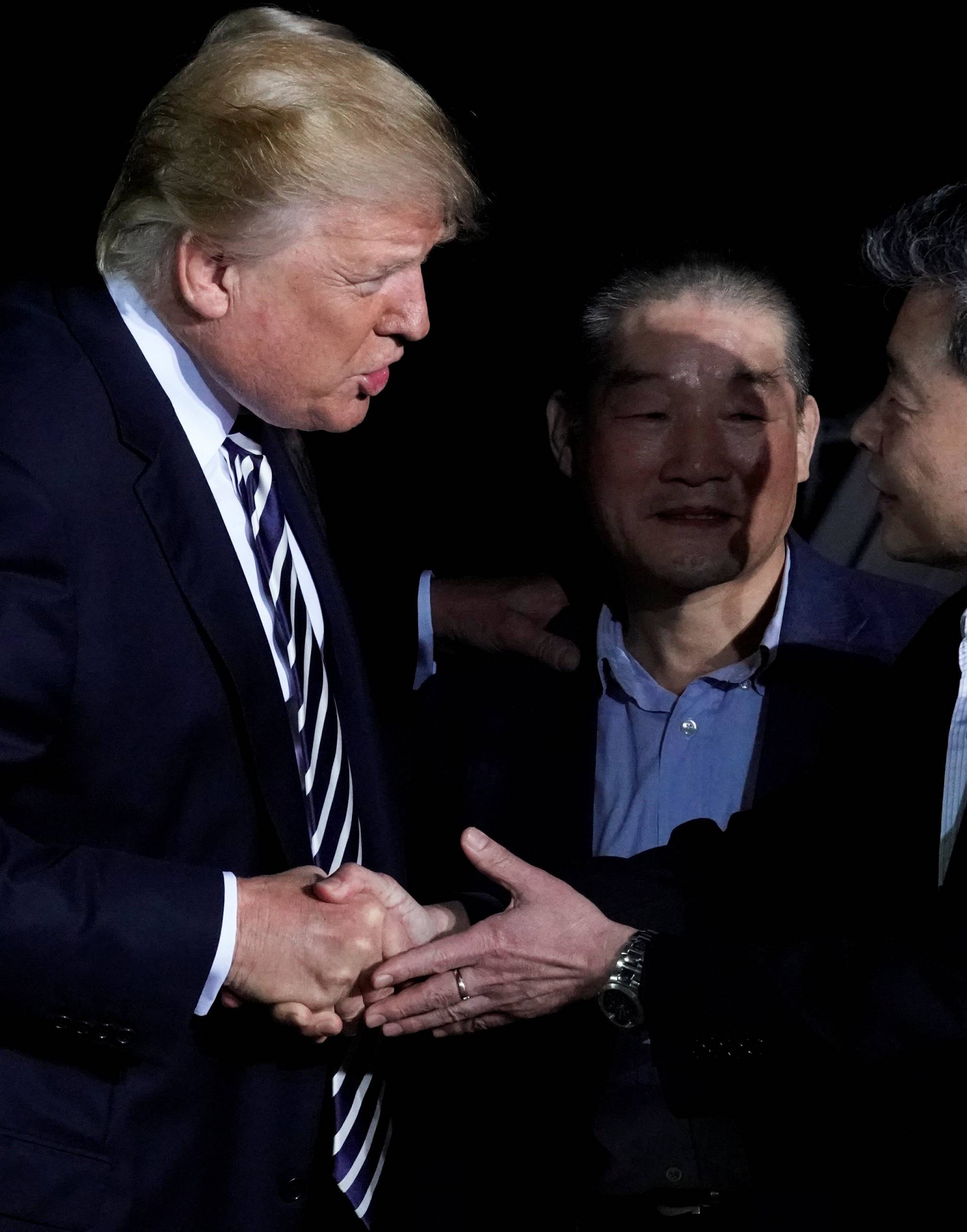 U.S.President Donald Trump greets the Americans released from detention in North Korea upon their arrival at Joint Base Andrews