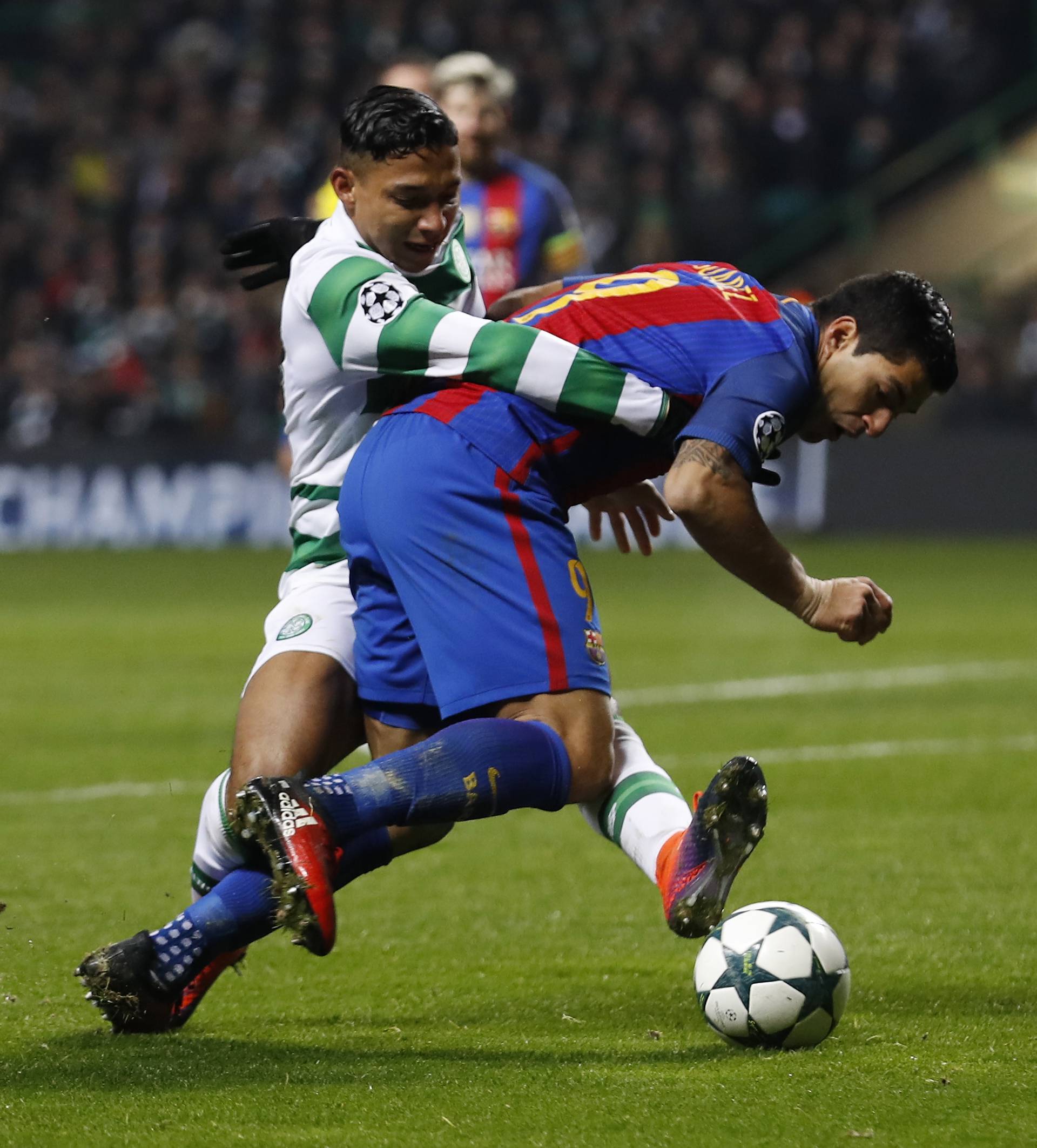 Barcelona's Luis Suarez in action with Celtic's Emilio Izaguirre