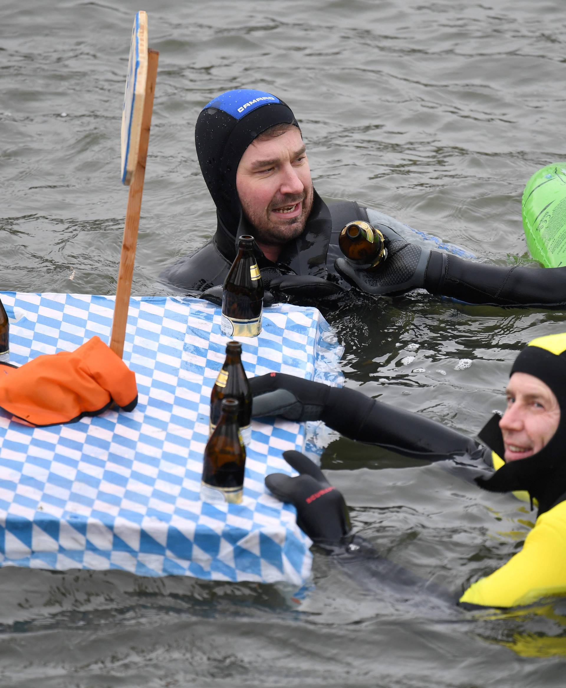 Swimmers wearing costumes bathe in the 3 degrees Celsius water of the river Danube during their annual 4 km swim, in Neuburg an der Donau