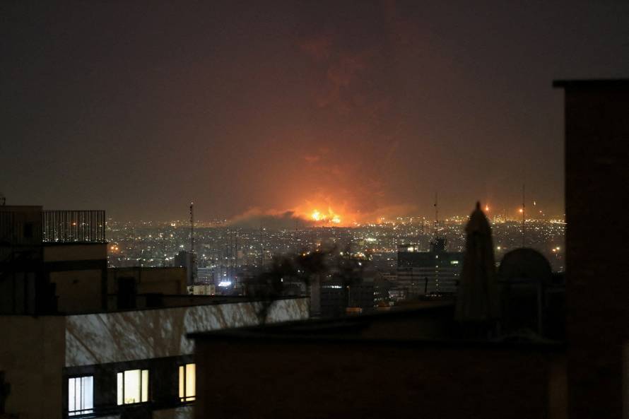 Smoke rises following an explosion, amid the U.S.-Israeli conflict with Iran, in Tehran