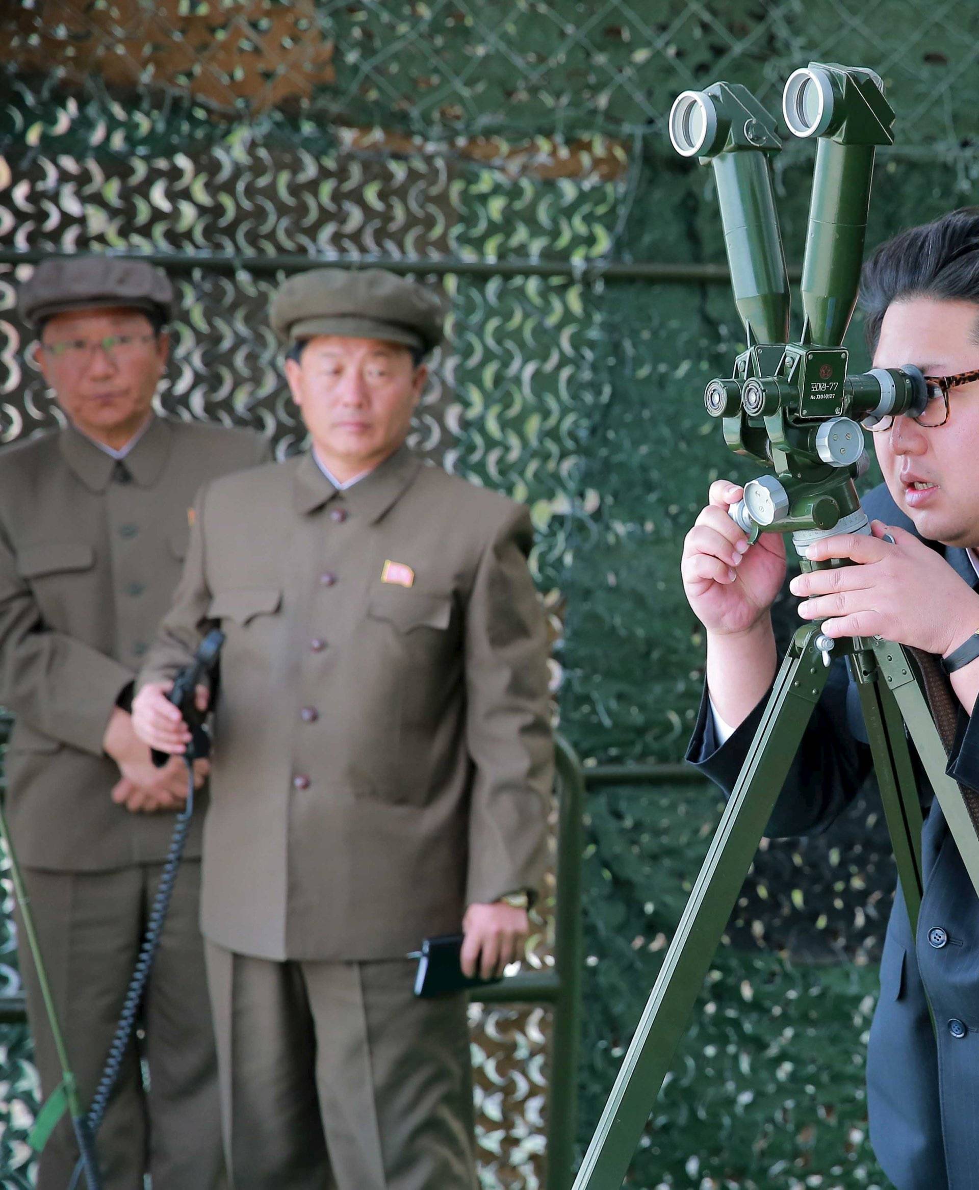 North Korean leader Kim Jong Un guides on the spot the underwater test-fire of strategic submarine ballistic missile