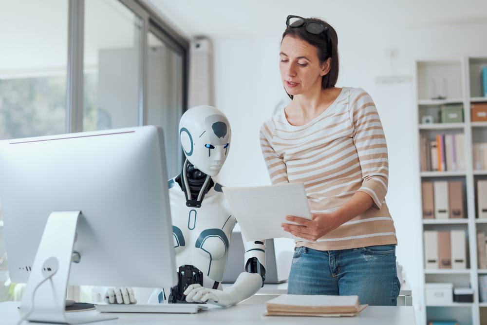 Woman,And,Ai,Robot,Working,Together,In,The,Office,,Automation