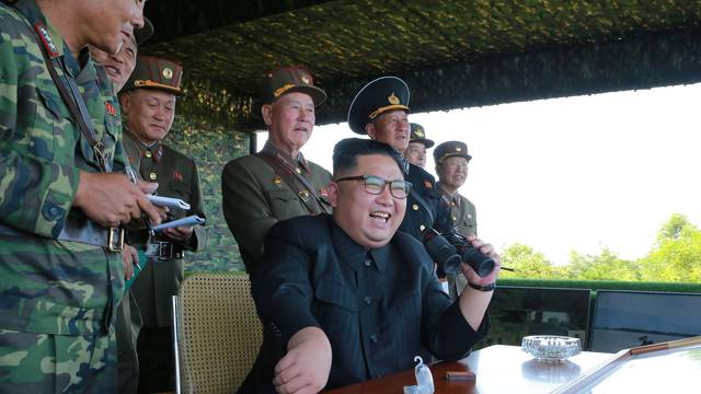 North Korean leader Kim Jong Un guides a target-striking contest of the special operation forces of the Korean People's Army (KPA) to occupy islands