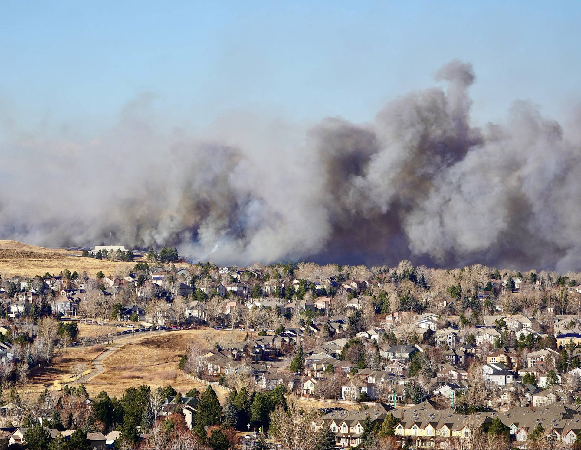 Smoke covers the skyline as a wind-driven wildfire forced evacuation of Superior suburb of Boulde