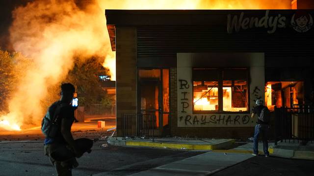 A Wendy’s burns following a rally against racial inequality and the police shooting death of Rayshard Brooks, in Atlanta