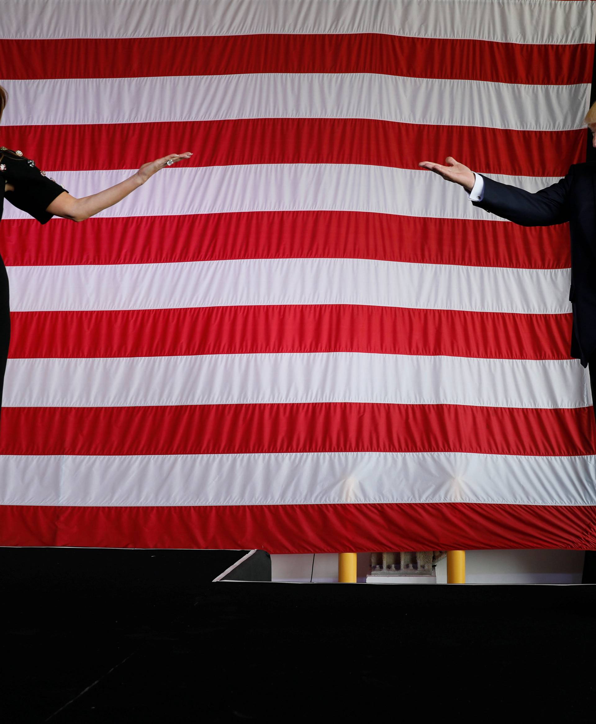 Trump and the first lady take the stage to rally with service members at Sigonella Air Force Base at Naval Air Station Sigonella at the end of Trump's participation in the G7 summit in Sicily, Italy
