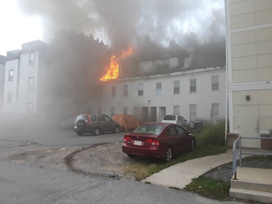Photo from social media by Boston Sparks shows a building burning after explosions in Lawrence, Massachusetts