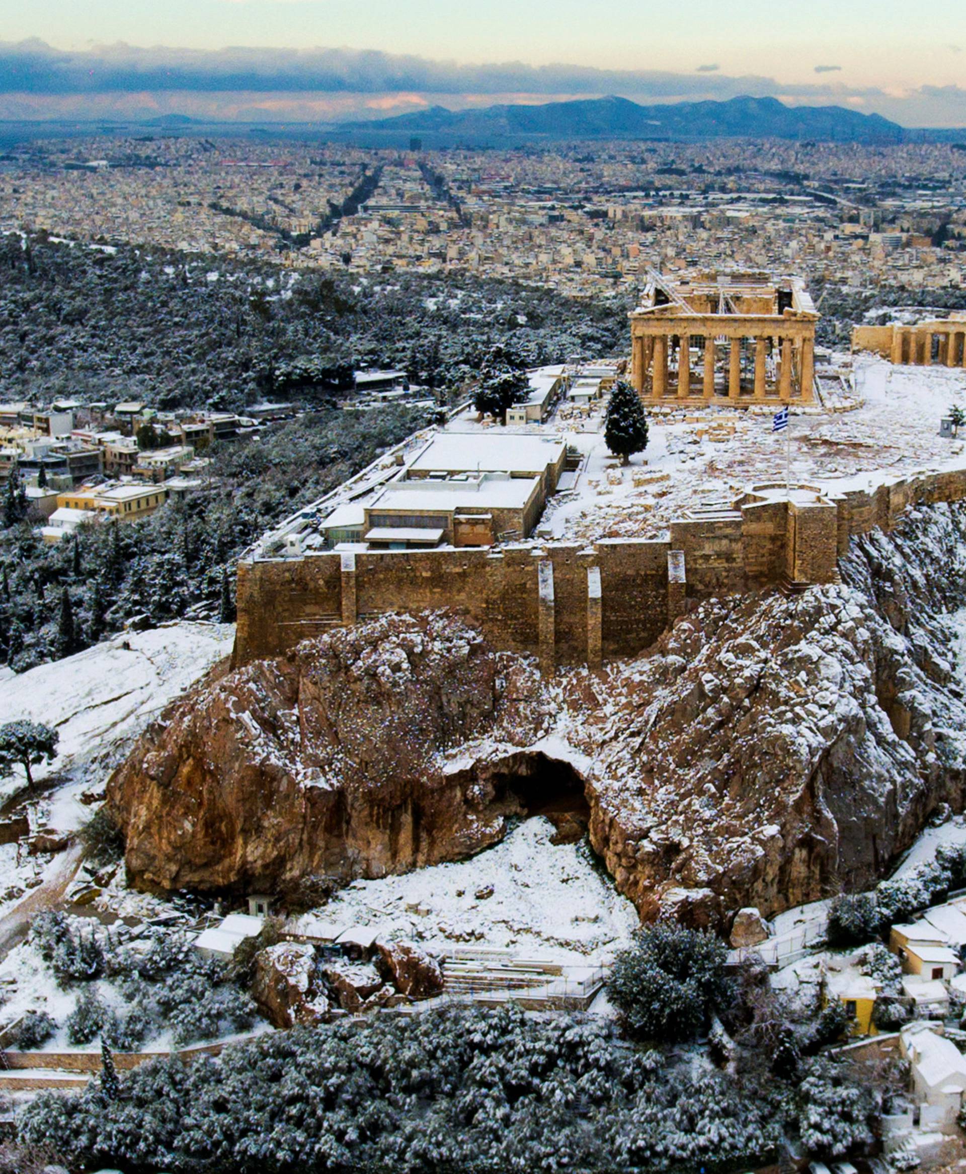 The Parthenon temple atop the ancient Acropolis is seen following a rare snowfall in Athens
