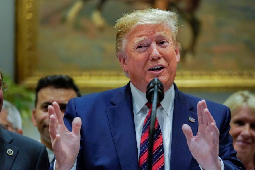 U.S. President Trump responds to questions from reporters at the White House in Washington