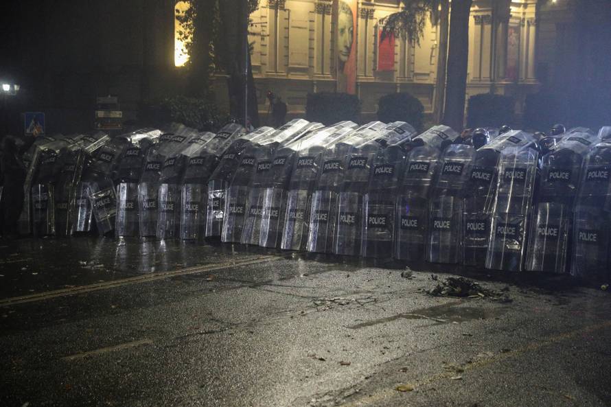 Supporters of Georgia's opposition attend a rally to protest, after government halts EU application until 2028, in Tbilisi
