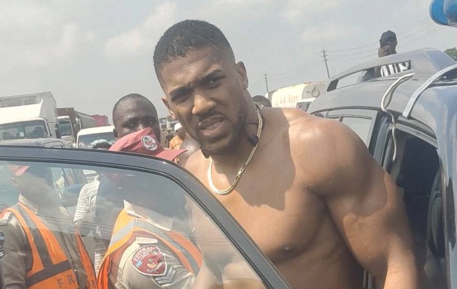 British boxer Anthony Joshua gets into an emergency responders' vehicle after being involved in a car crash in Nigeria's Ogun State