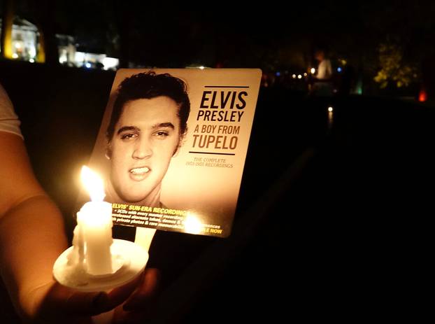 Mourners gather to commemorate the 40th anniversary of the death of singer Elvis Presley in Memphis