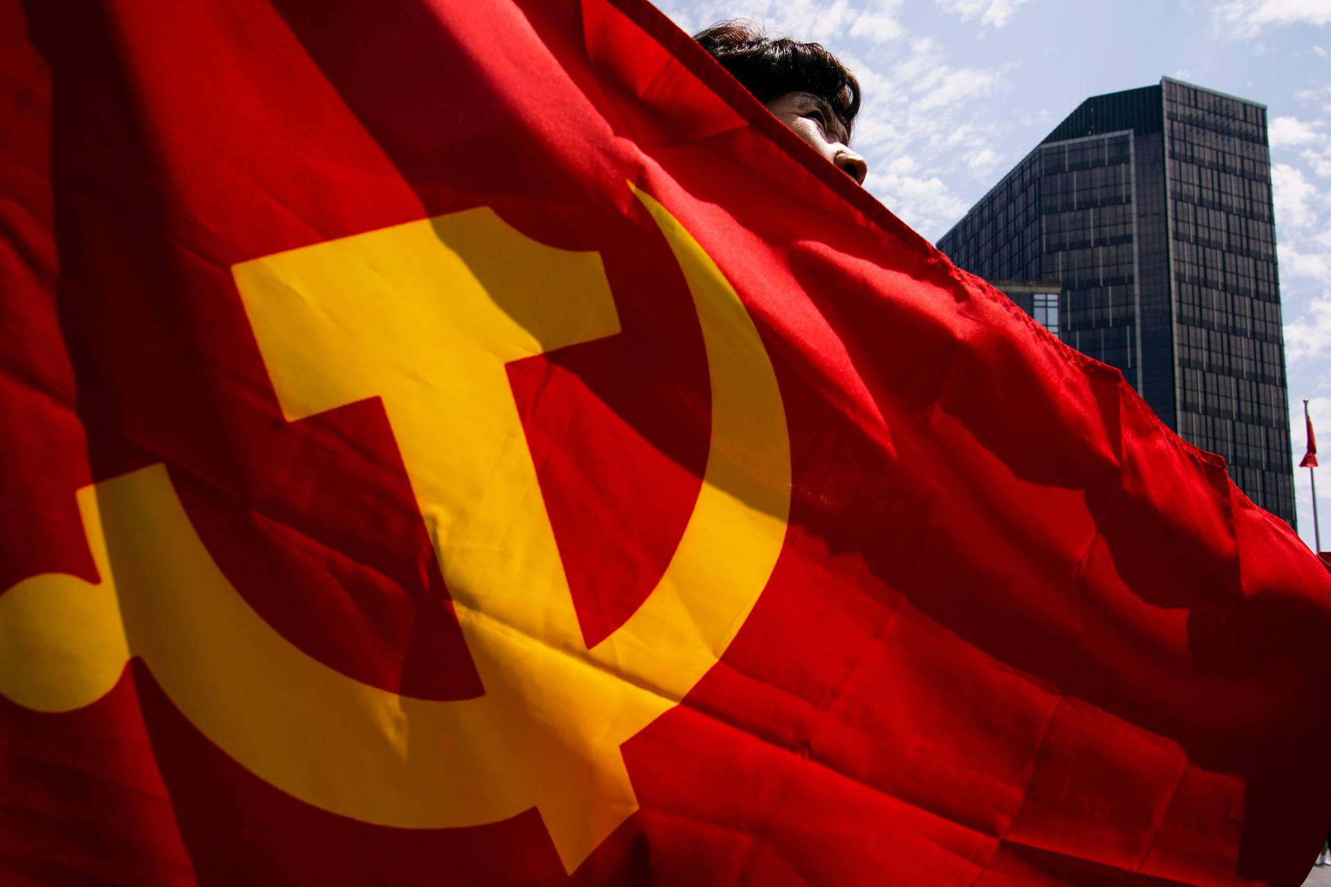 People attend an event marking the 100th founding anniversary of the Communist Party of China, in Shanghai