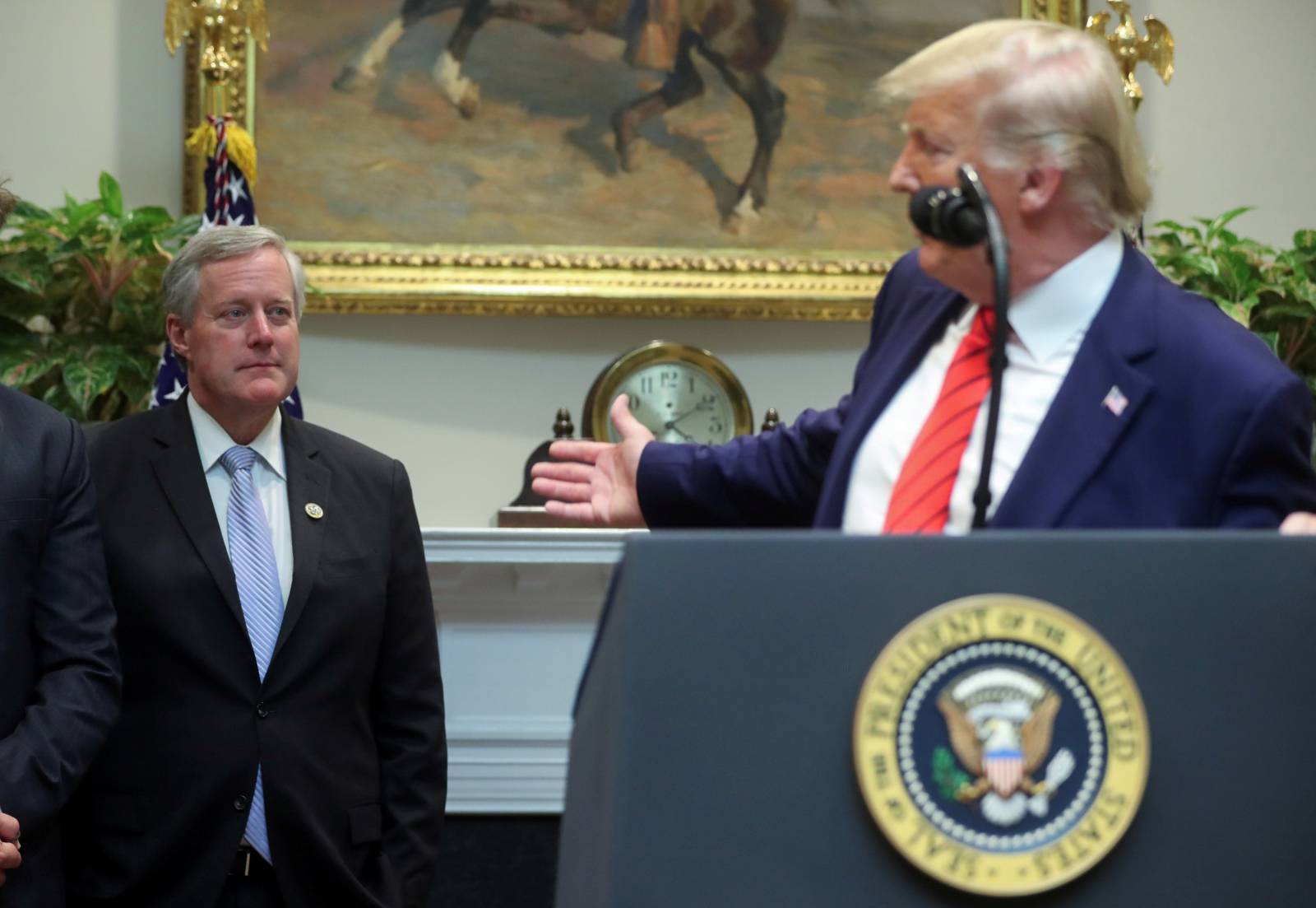 FILE PHOTO:  U.S. President Trump answers questions during event to sign executive orders at the White House in Washington