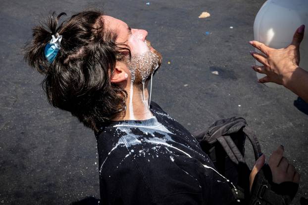 Standoff by protesters and law enforcement, following multiple detentions by ICE in Los Angeles County