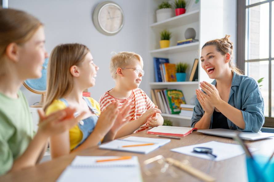 Happy,Kids,And,Teacher,At,School.,Woman,And,Children,Are