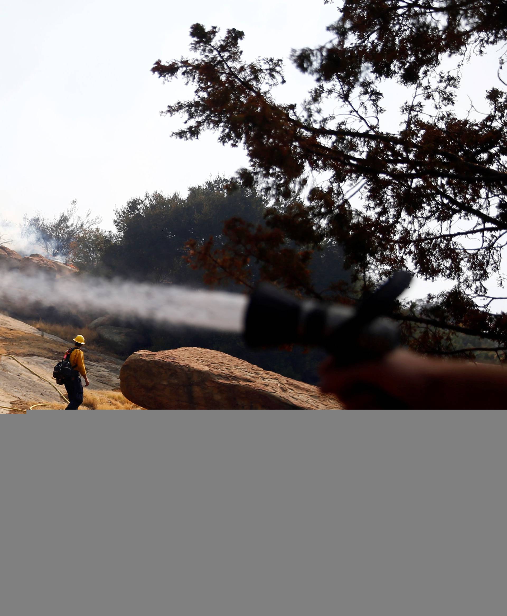 Firefighters battle the Peak fire in Simi Valley
